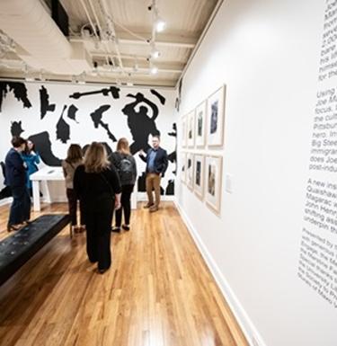People milling around an art gallery