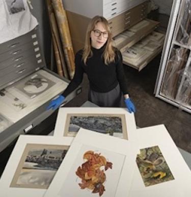 Deirdre Smith with artworks at the Carnegie Museum of Natural History